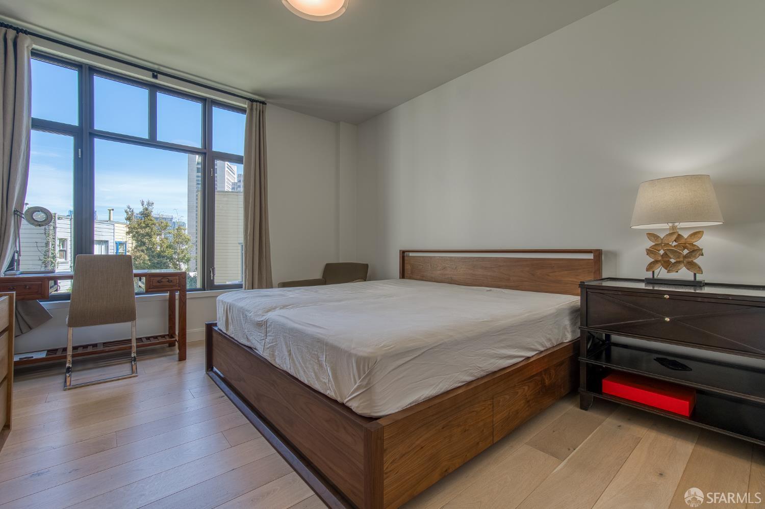 875 California Street, Unit 403 San Francisco, CA 94108 - Photo 42 of 56 a bed sitting in a bedroom next to a window