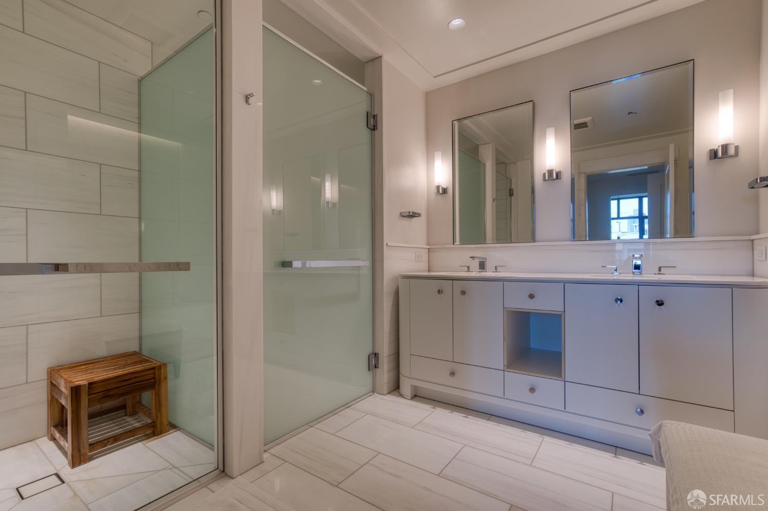 875 California Street, Unit 403 San Francisco, CA 94108 - Photo 44 of 56 a bathroom with a double vanity sink and a mirror