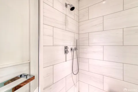 a bathroom with a sink toilet and mirror