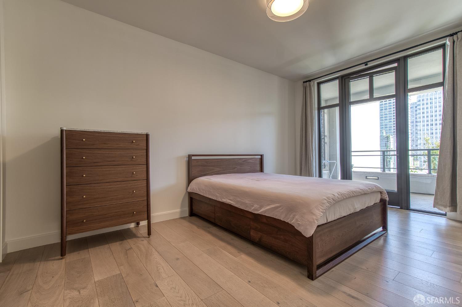 875 California Street, Unit 403 San Francisco, CA 94108 - Photo 48 of 56 a spacious bedroom with a bed and a dresser