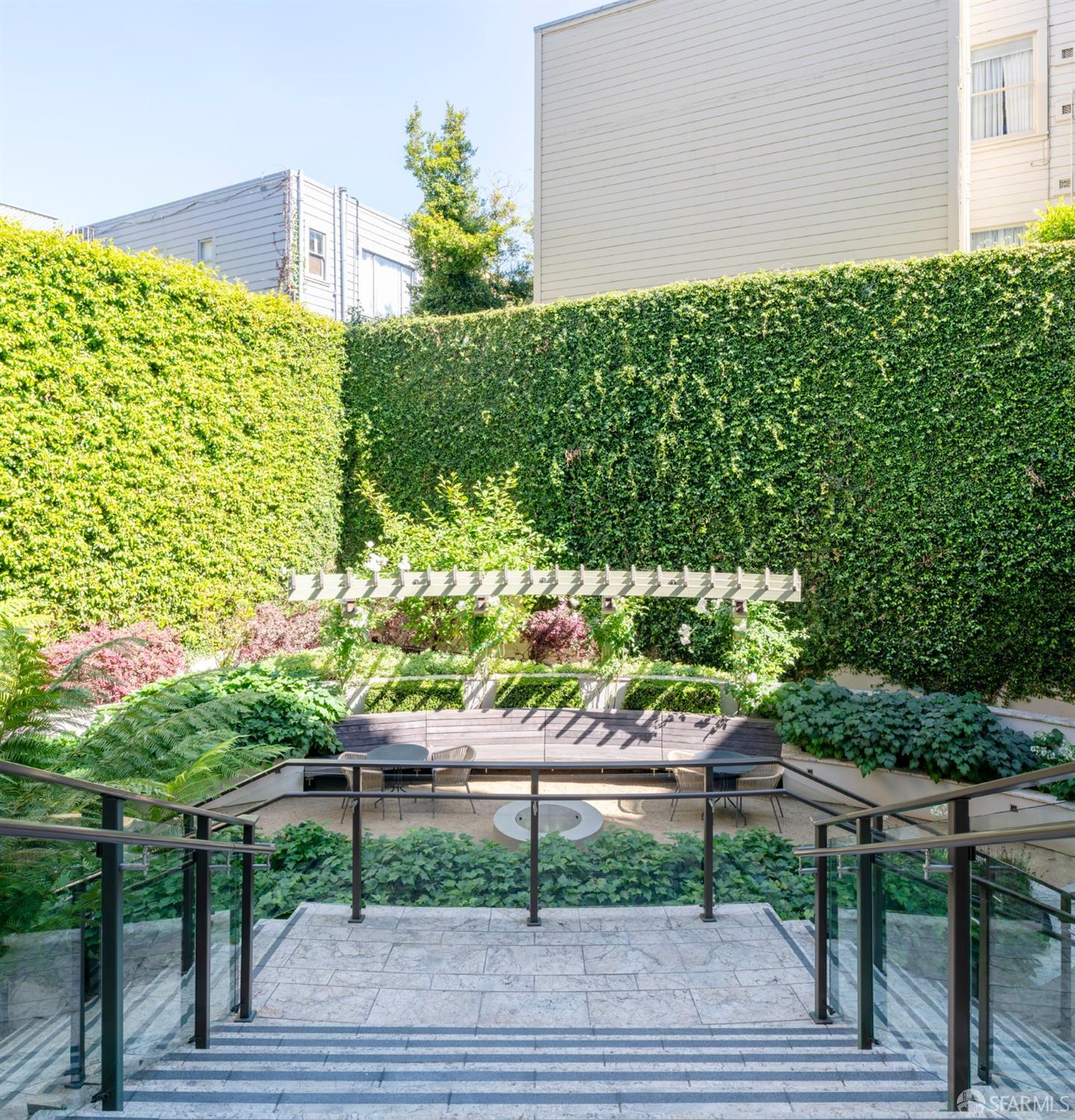 875 California Street, Unit 403 San Francisco, CA 94108 - Photo 5 of 56 a view of a bench in a garden