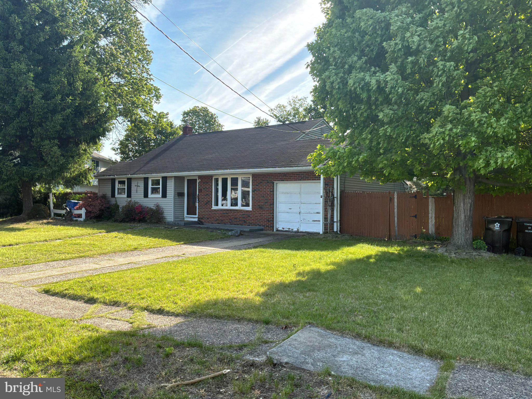 812 Colby Avenue Delran, NJ 08075 - Photo 2 of 17 Charming brick home with lush greenery.