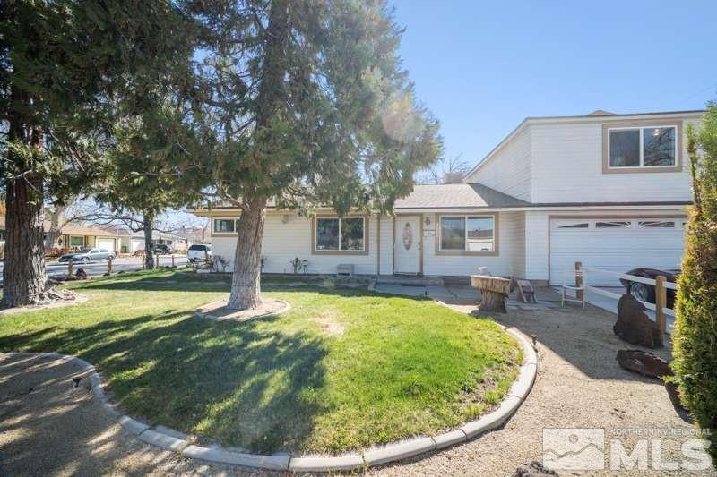 a view of a house with swimming pool and sitting area