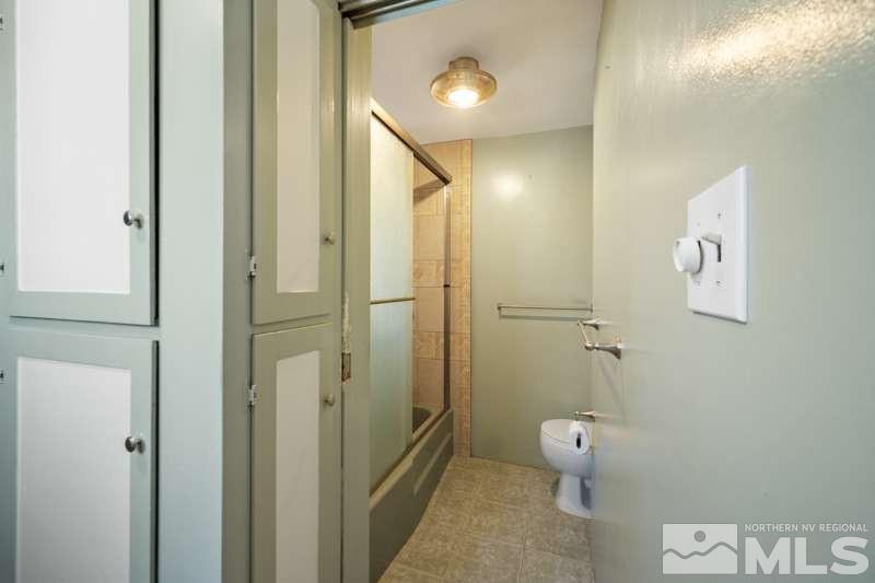 2080 4th Street Sparks, NV 89431 - Photo 16 of 27 a bathroom with a shower and a toilet