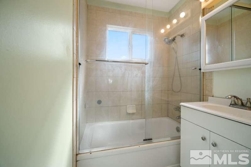 2080 4th Street Sparks, NV 89431 - Photo 21 of 27 a bathroom with a bathtub and a sink