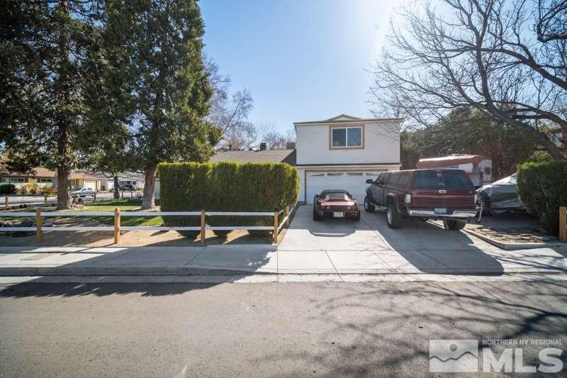 2080 4th Street Sparks, NV 89431 - Photo 3 of 27 a view of a patio with a table and chairs with wooden floor and fence
