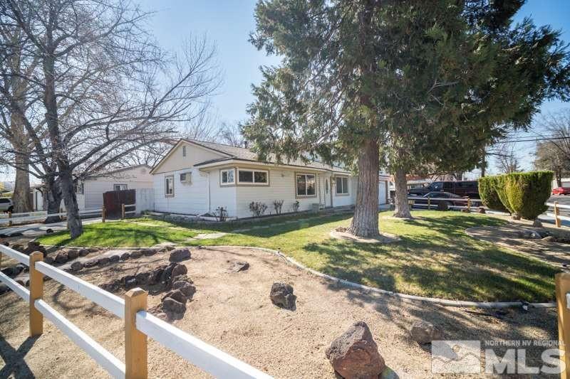 2080 4th Street Sparks, NV 89431 - Photo 4 of 27 a view of a white house with a yard