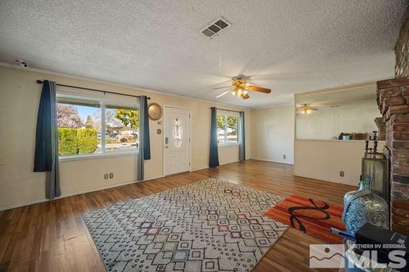 2080 4th Street Sparks, NV 89431 - Photo 6 of 27 a view of empty room with wooden floor and fan