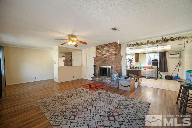 2080 4th Street Sparks, NV 89431 - Photo 7 of 27 a living room with furniture and a fireplace