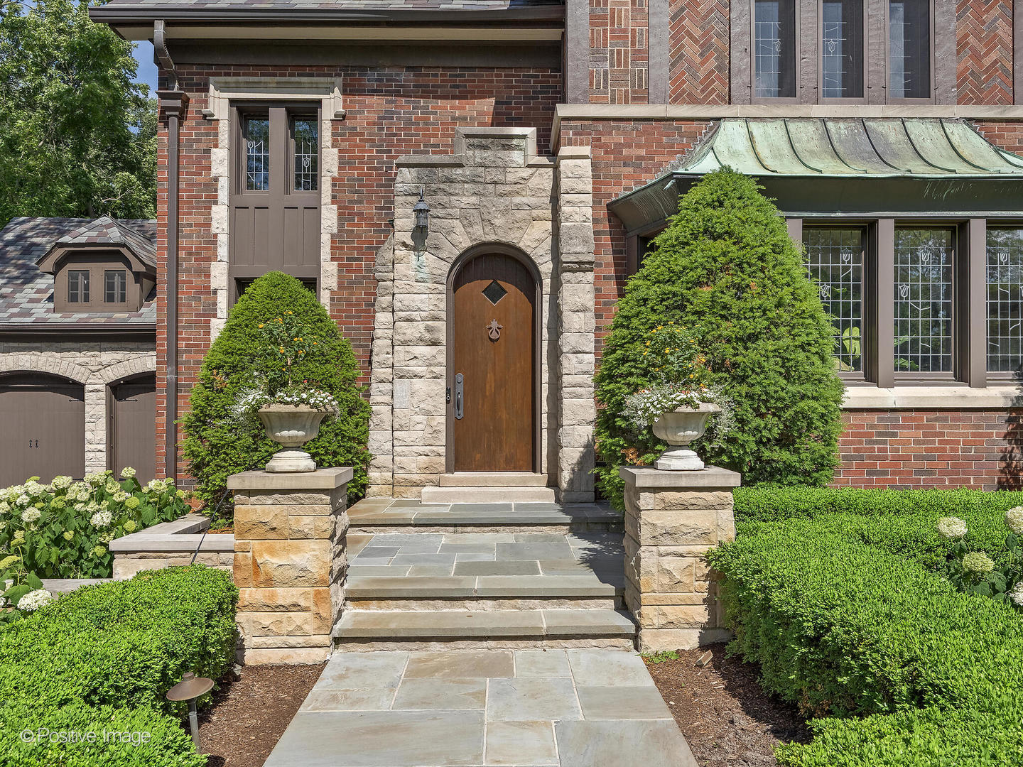841 South County Line Road Hinsdale, IL 60521 - Photo 4 of 15 a front view of a house with plants and garden