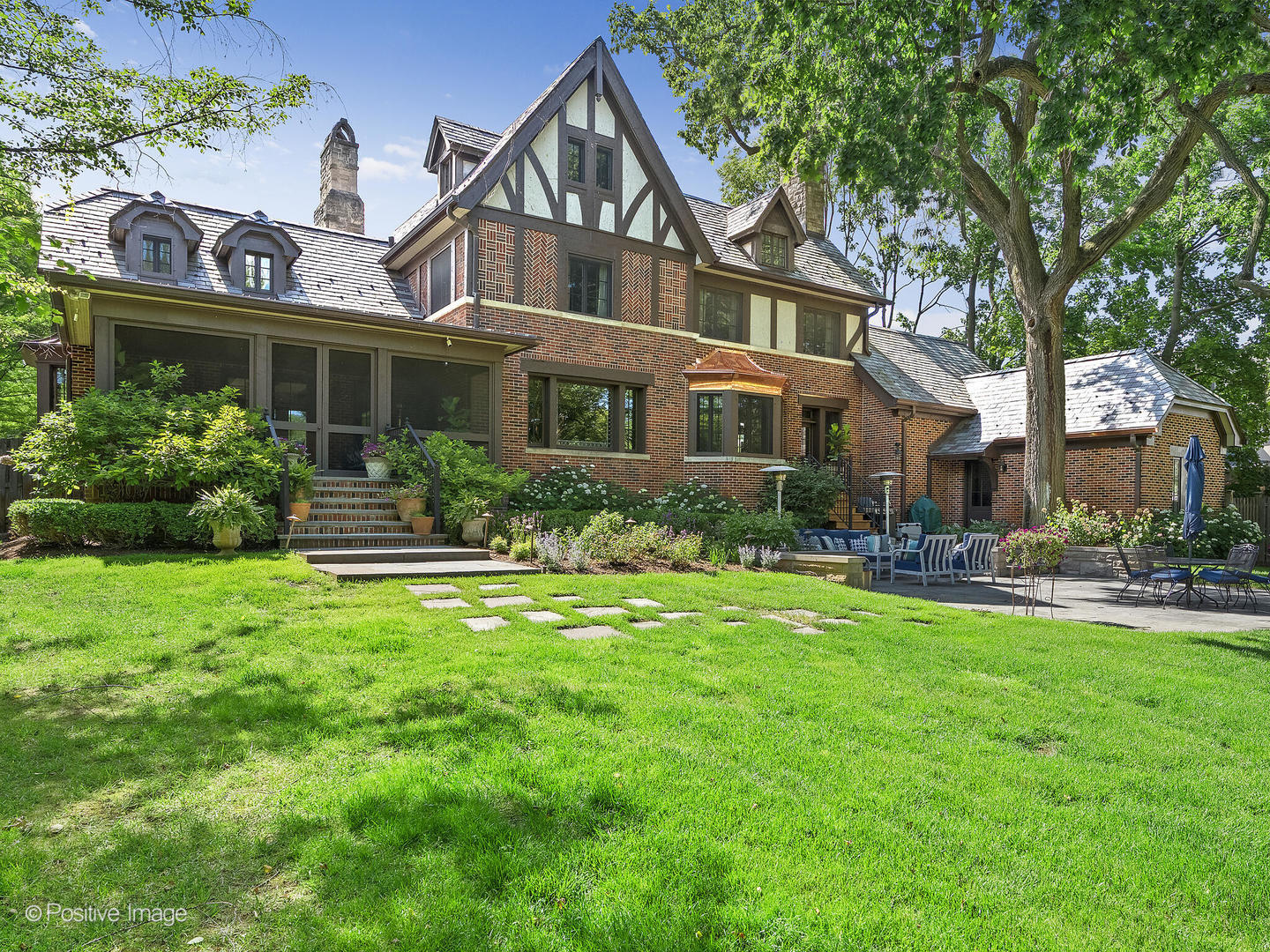 841 South County Line Road Hinsdale, IL 60521 - Photo 10 of 15 a front view of house with yard and outdoor seating