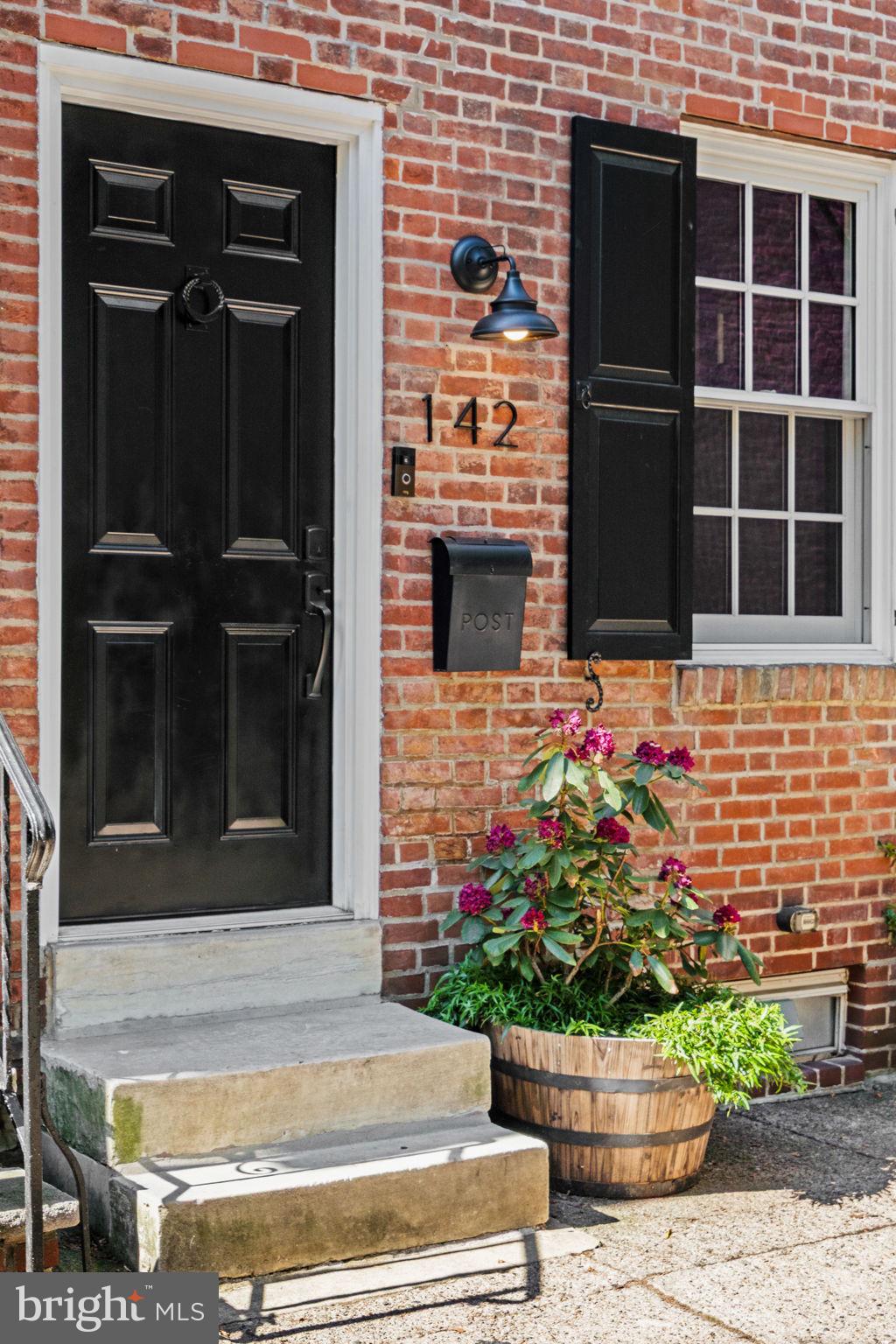 142 Carpenter Street Philadelphia, PA 19147 - Photo 47 of 49 a front view of a house with a potted plant
