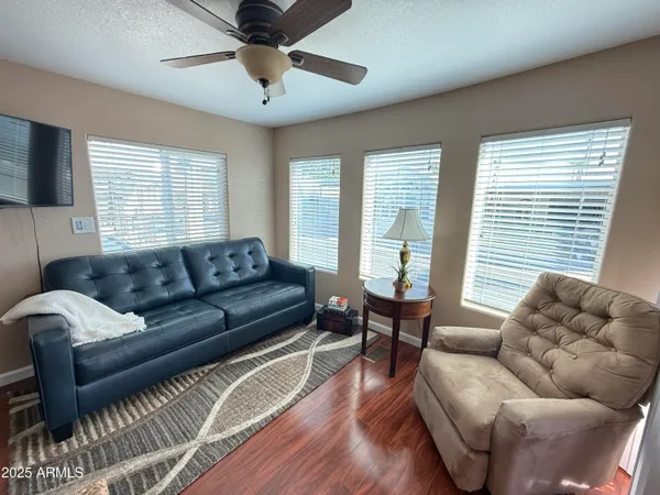 a living room with furniture and a large window
