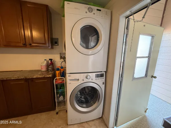 a utility room with dryer and washer