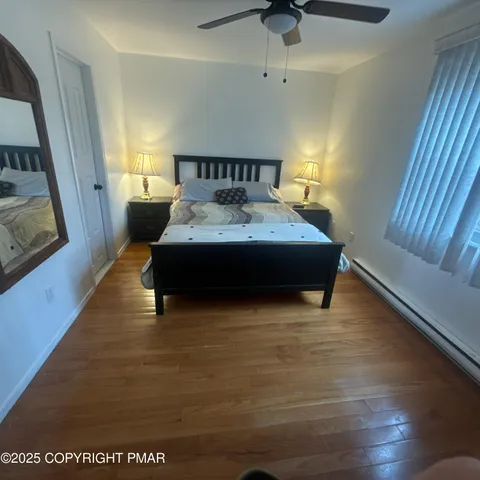 a bed room with a bed and a window