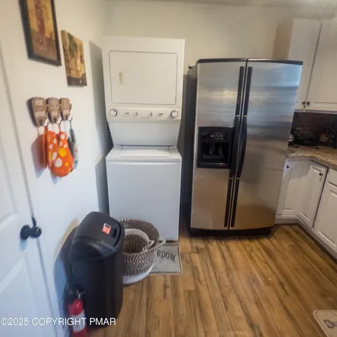 a room with water heater and wooden floor