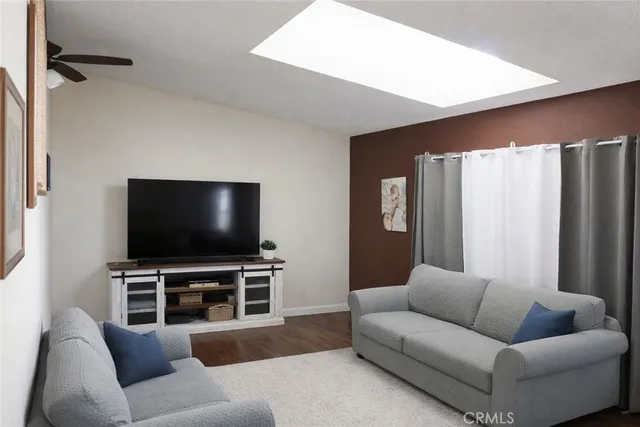 a kitchen with kitchen island a counter top space a sink a stove and a refrigerator