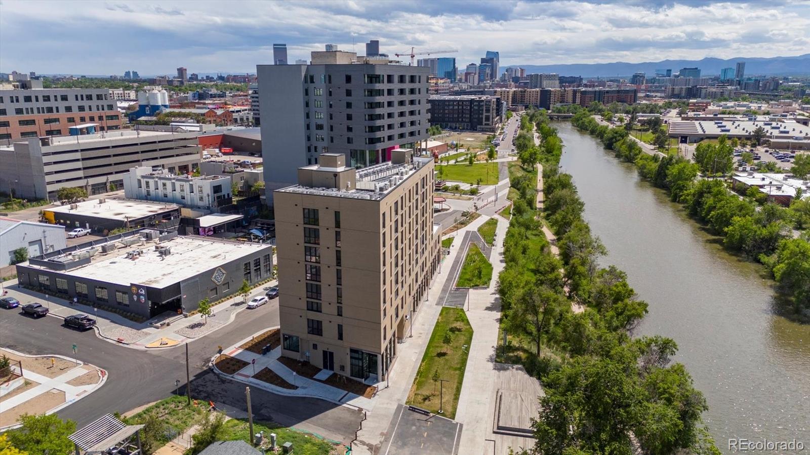 3575 Chestnut Place, Unit 203 Denver, CO 80216 - Photo 14 of 14 a view of a lake with tall buildings