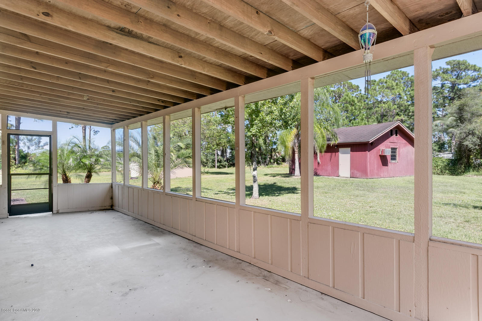 1695 Emmaus Road Northwest Palm Bay, FL 32907 - Photo 11 of 30 a view of backyard and window