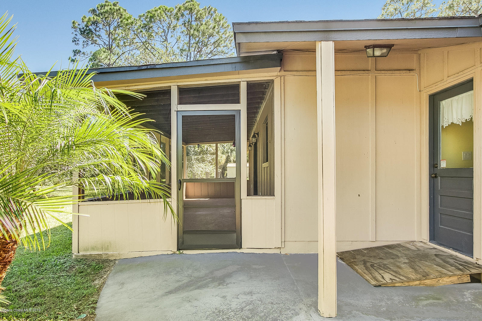 1695 Emmaus Road Northwest Palm Bay, FL 32907 - Photo 24 of 30 a view of front door of house
