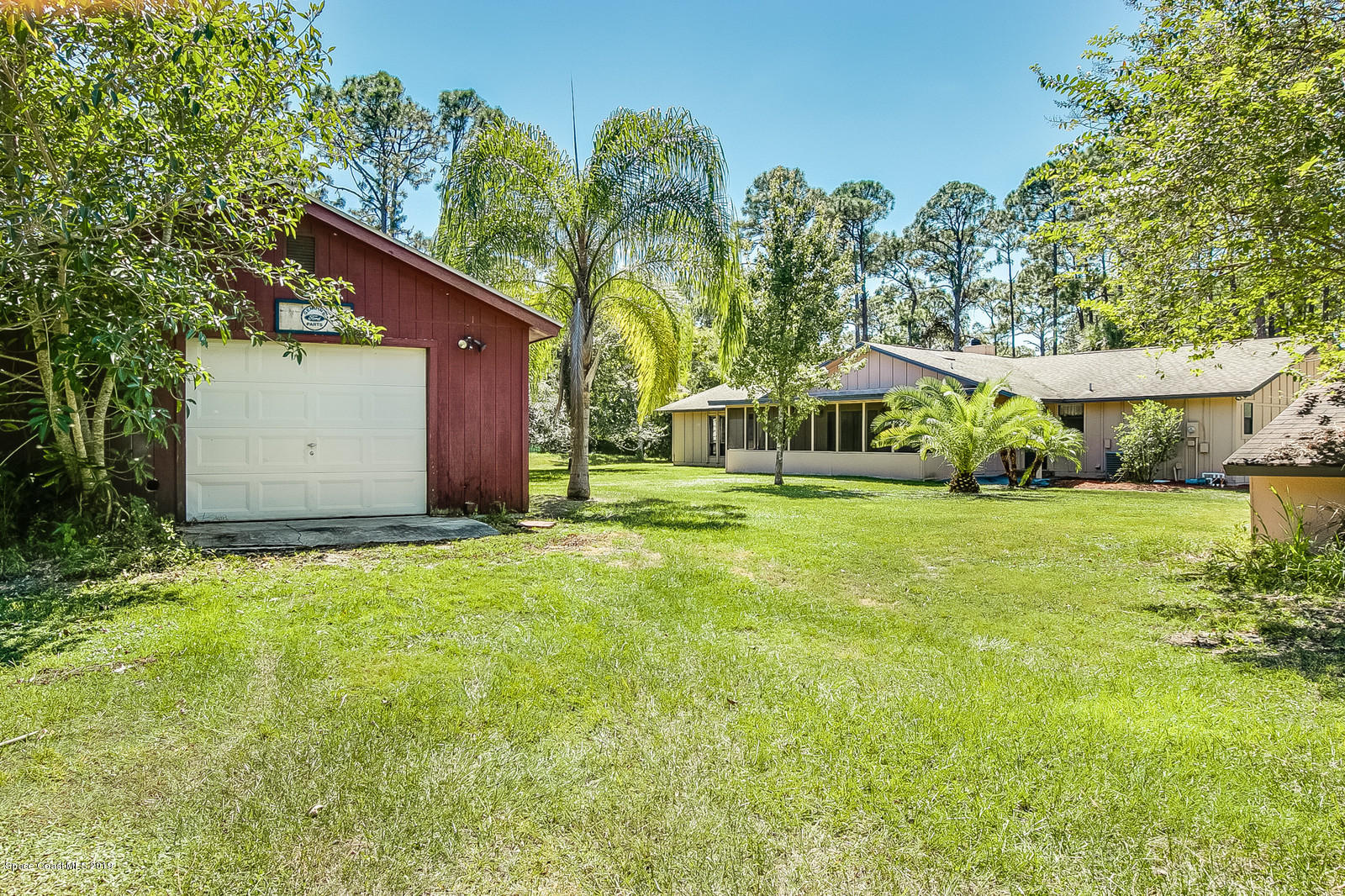 1695 Emmaus Road Northwest Palm Bay, FL 32907 - Photo 28 of 30 a house view with a garden space