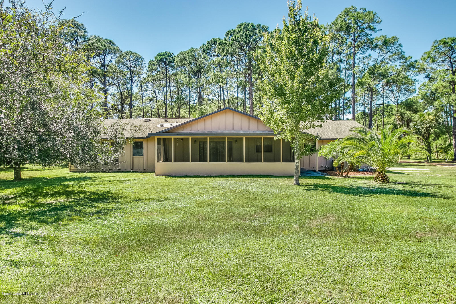 1695 Emmaus Road Northwest Palm Bay, FL 32907 - Photo 30 of 30 a front view of a house with a yard