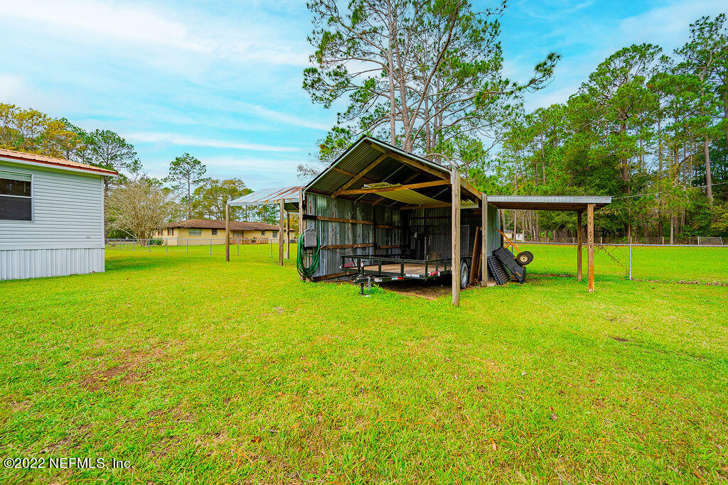 540532 Lem Turner Road Callahan, FL 32011 - Photo 49 of 62 a view of a house with a backyard porch and sitting area
