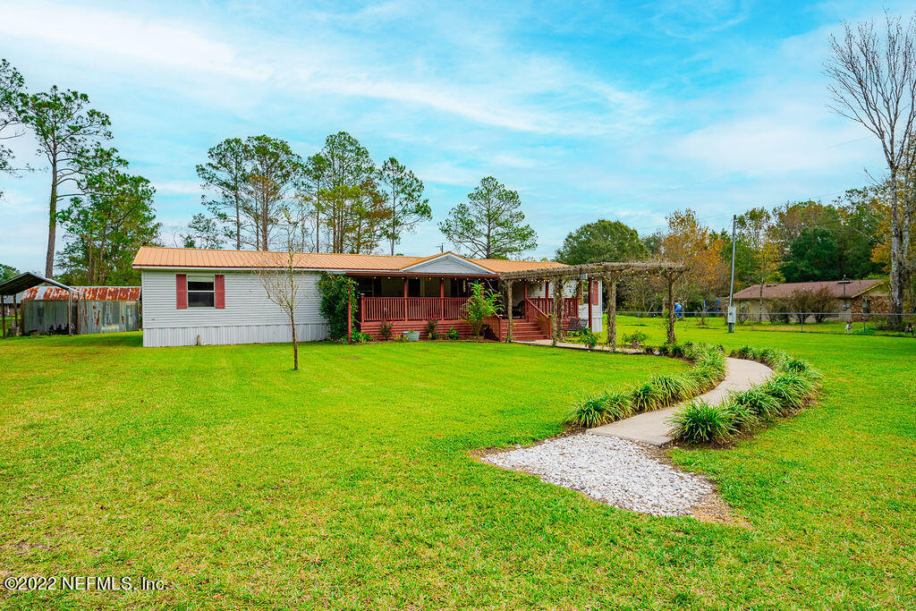 540532 Lem Turner Road Callahan, FL 32011 - Photo 50 of 62 a view of an house with backyard space and balcony