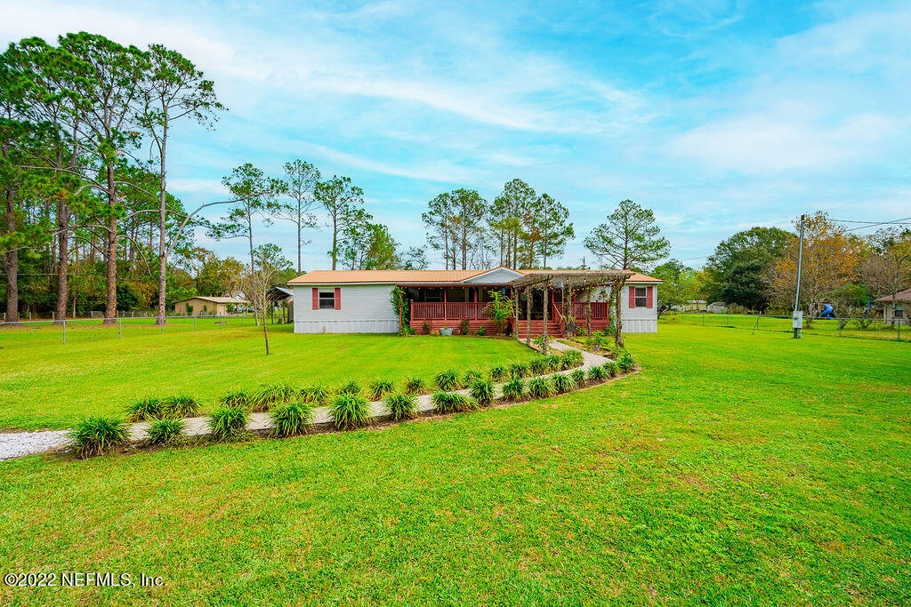 540532 Lem Turner Road Callahan, FL 32011 - Photo 54 of 62 a view of a house with a big yard
