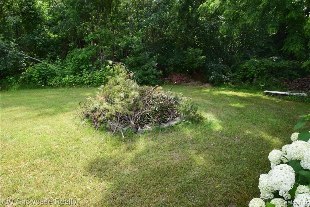 17350 Fish Lake Road Holly, MI 48442 - Photo 25 of 30 A firepit area for those cool nights.