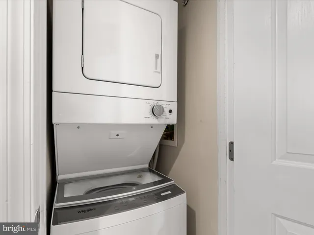 a view of an empty room and wooden floor