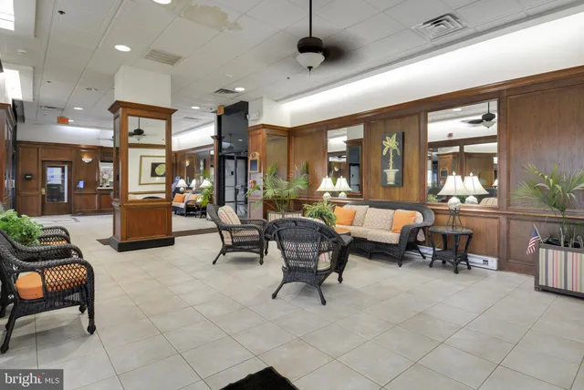 a room with pool table and windows