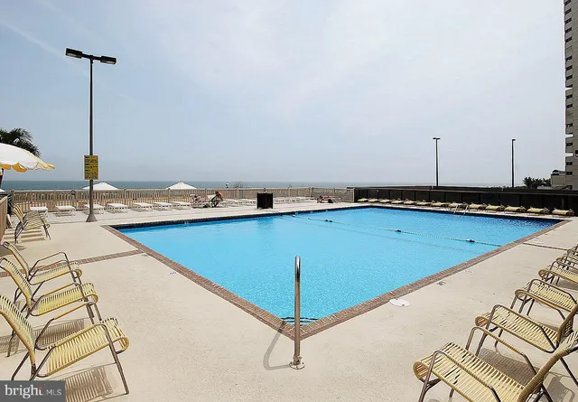 a view of swimming pool with a patio