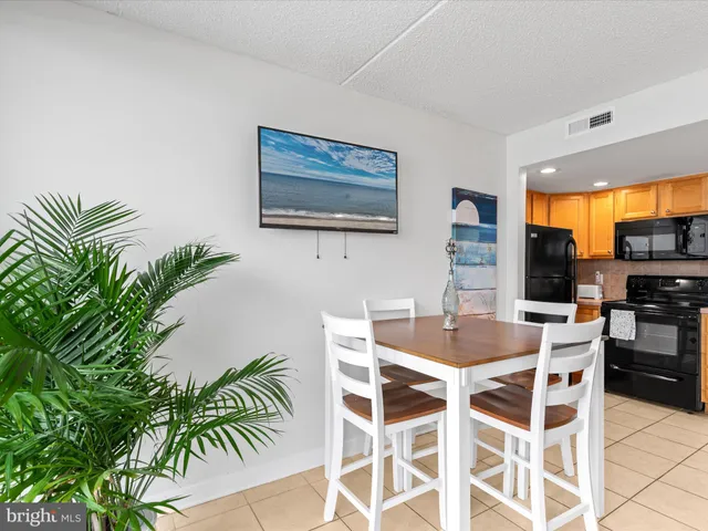 a living room with furniture and a night stand