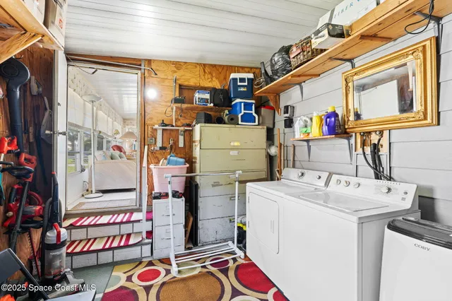 a dining room with furniture and a chandelier