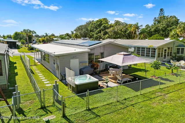 an aerial view of a house with outdoor space