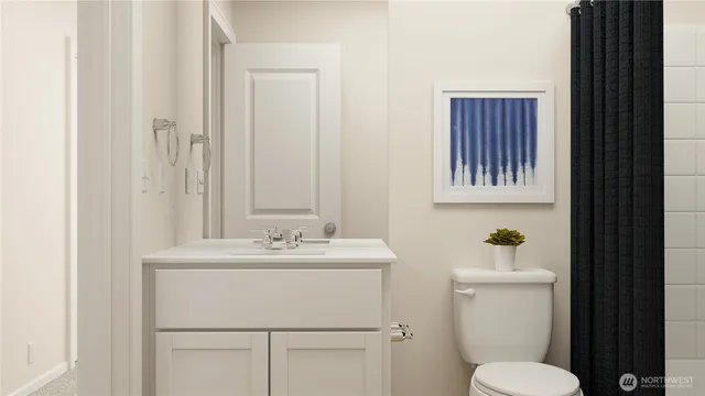 a bathroom with a sink toilet and mirror
