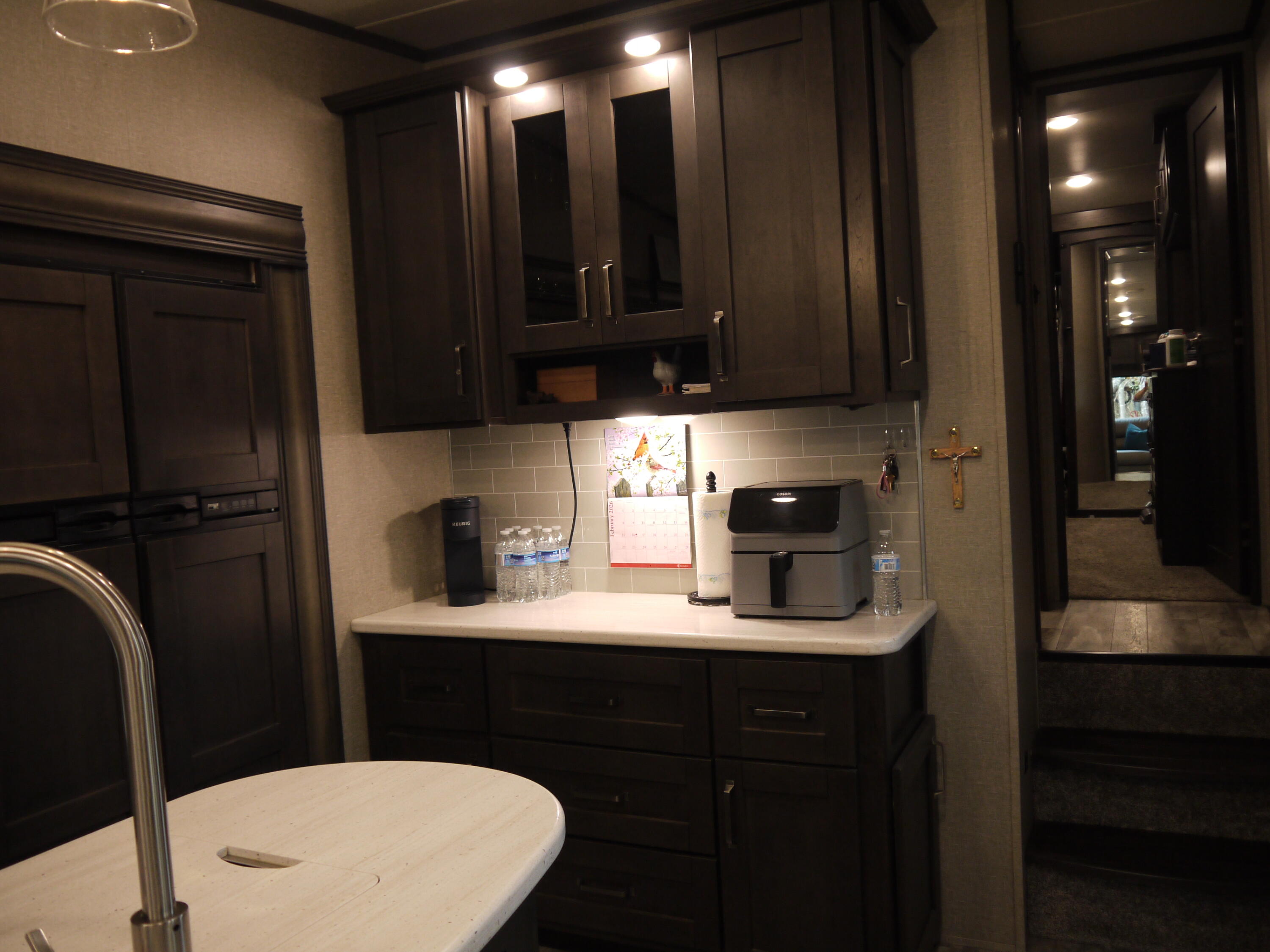 4449 Yellow Bluff Road Crestview, FL 32539 - Photo 29 of 42 a kitchen with a sink a refrigerator and cabinets