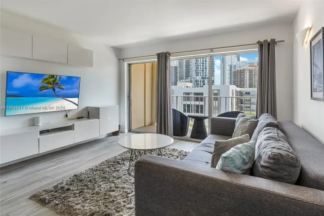 a living room with furniture and a rug