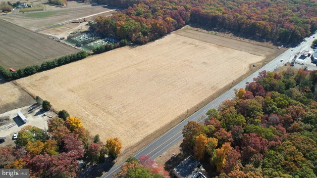 a view of a wooden wall and mountains in the background