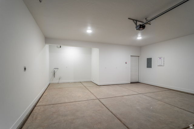 2768 Becco Trail, Unit 63 St. George, UT 84770 - Photo 25 of 27 Garage featuring baseboards and electric panel