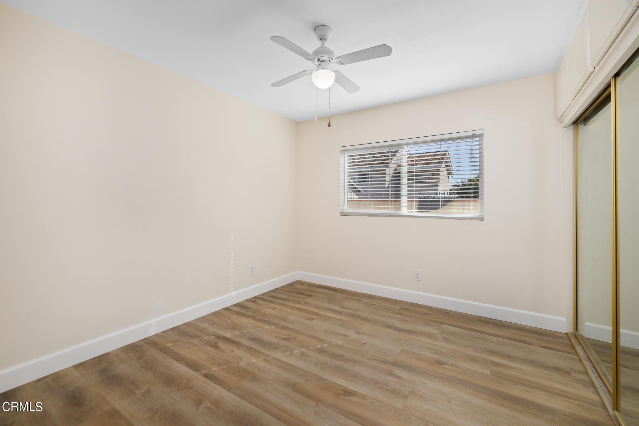 4516 Earle Avenue Rosemead, CA 91770 - Photo 14 of 23 an empty room with a chandelier fan and windows
