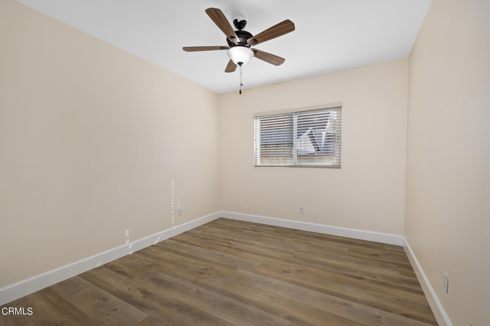 4516 Earle Avenue Rosemead, CA 91770 - Photo 17 of 23 an empty room with wooden floor and ceiling fan