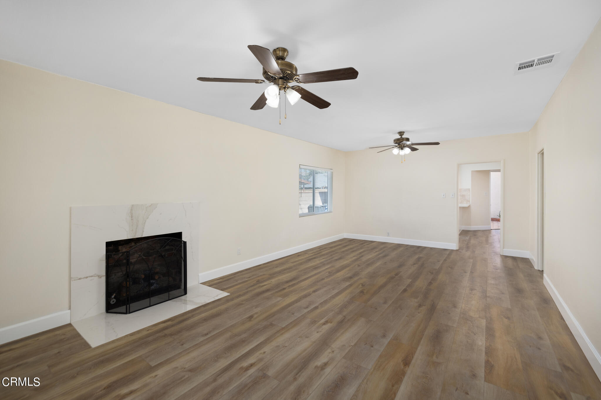 4516 Earle Avenue Rosemead, CA 91770 - Photo 3 of 23 a view of a livingroom with wooden floor and a ceiling fan