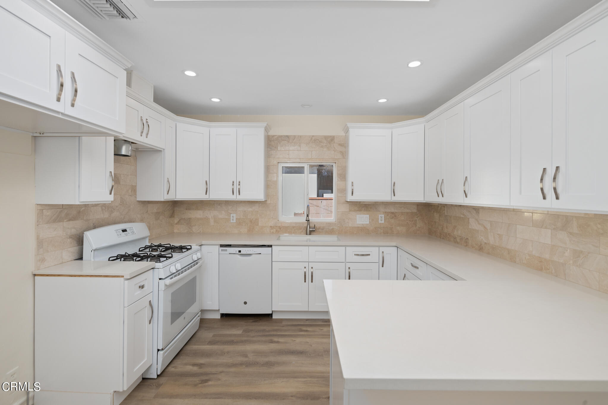 4516 Earle Avenue Rosemead, CA 91770 - Photo 6 of 23 a kitchen that has a lot of cabinets in it and wooden floors