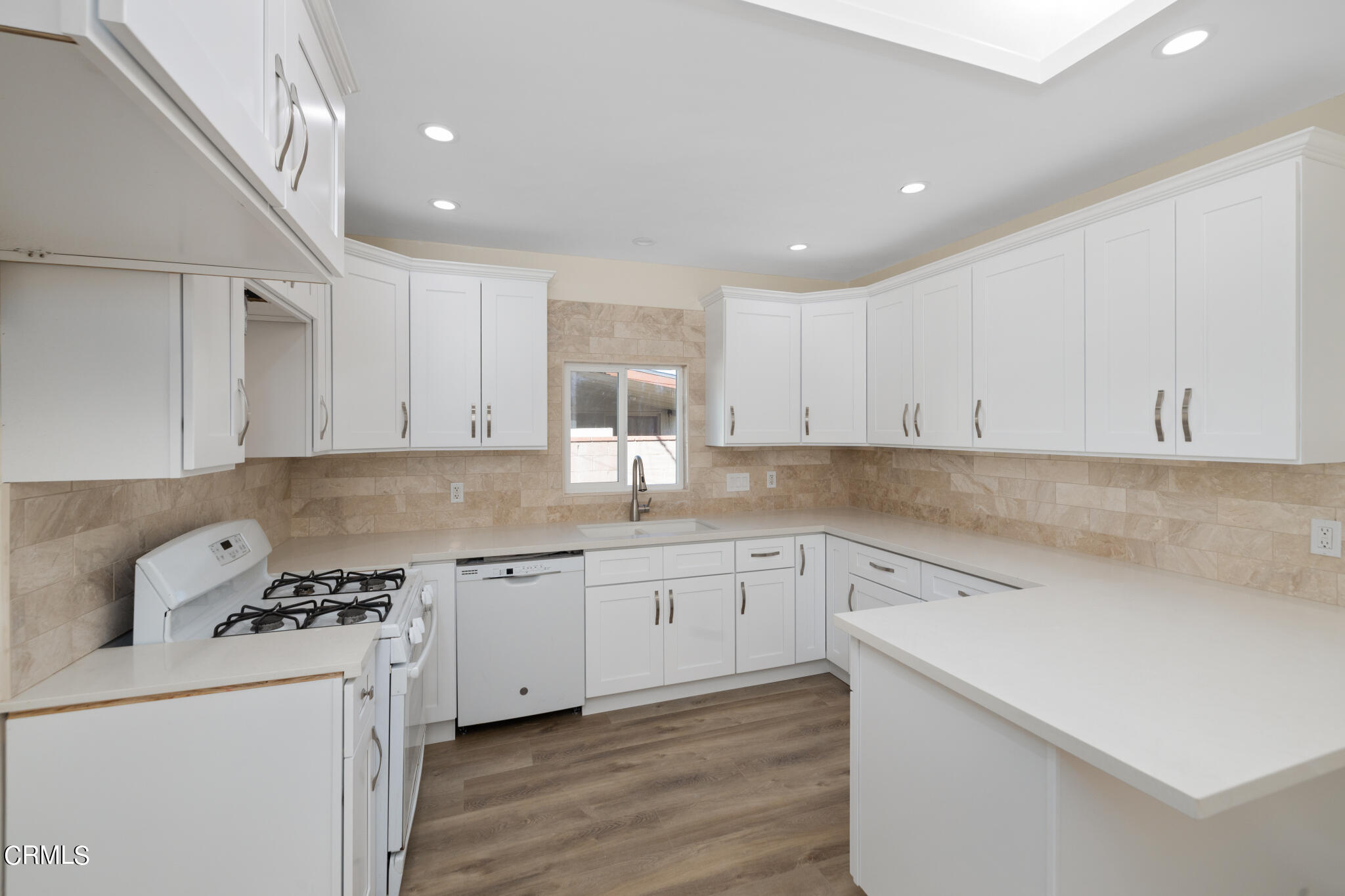 4516 Earle Avenue Rosemead, CA 91770 - Photo 9 of 23 a kitchen with a sink a stove and cabinets