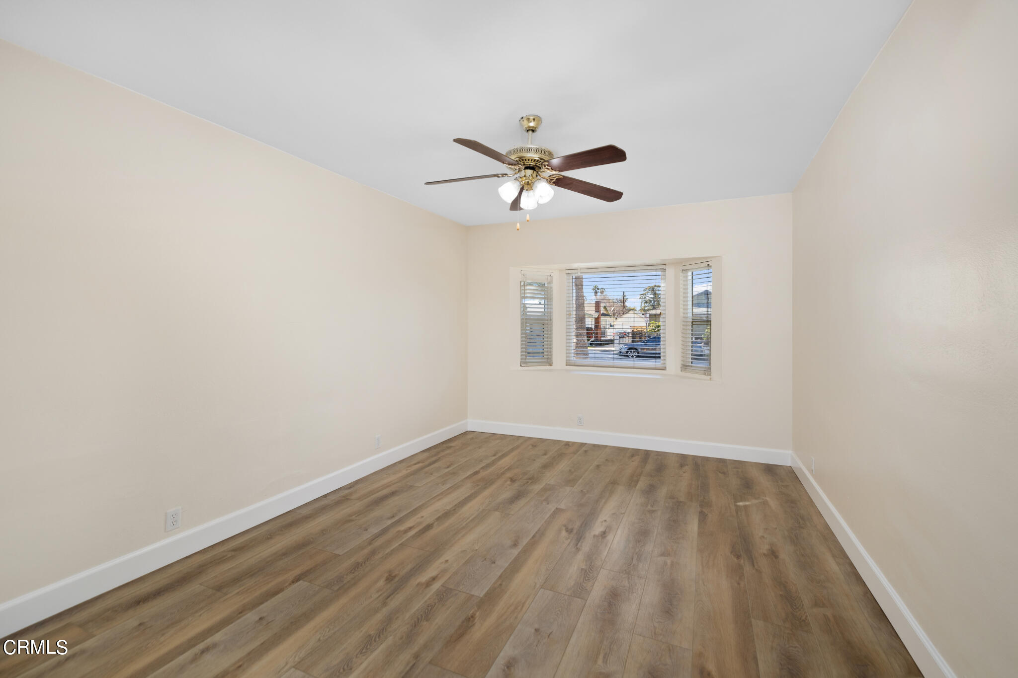 4516 Earle Avenue Rosemead, CA 91770 - Photo 10 of 23 an empty room with wooden floor and ceiling fan
