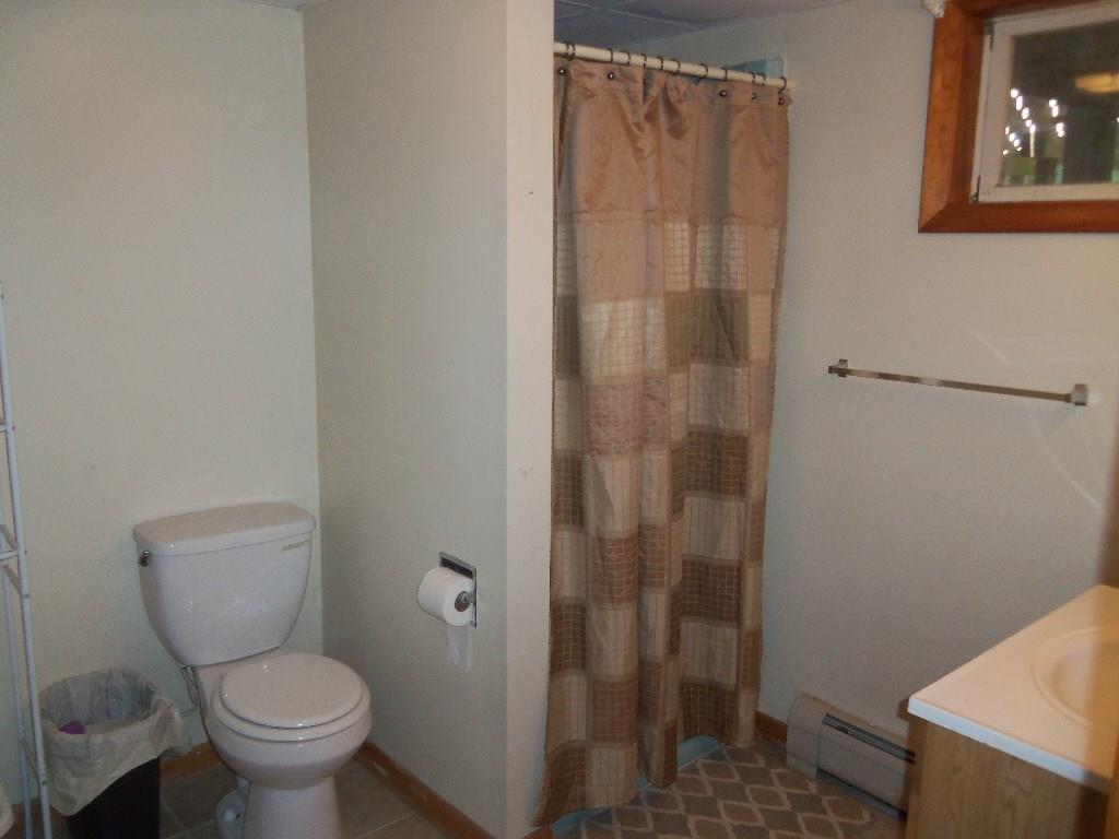 1192 Main Road Eddington, ME 04428 - Photo 14 of 35 laundry bathroom combo with new tile...