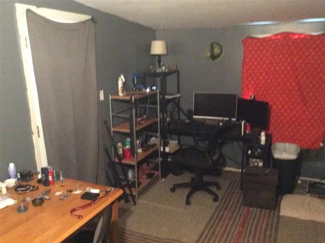 a view of a workspace with furniture