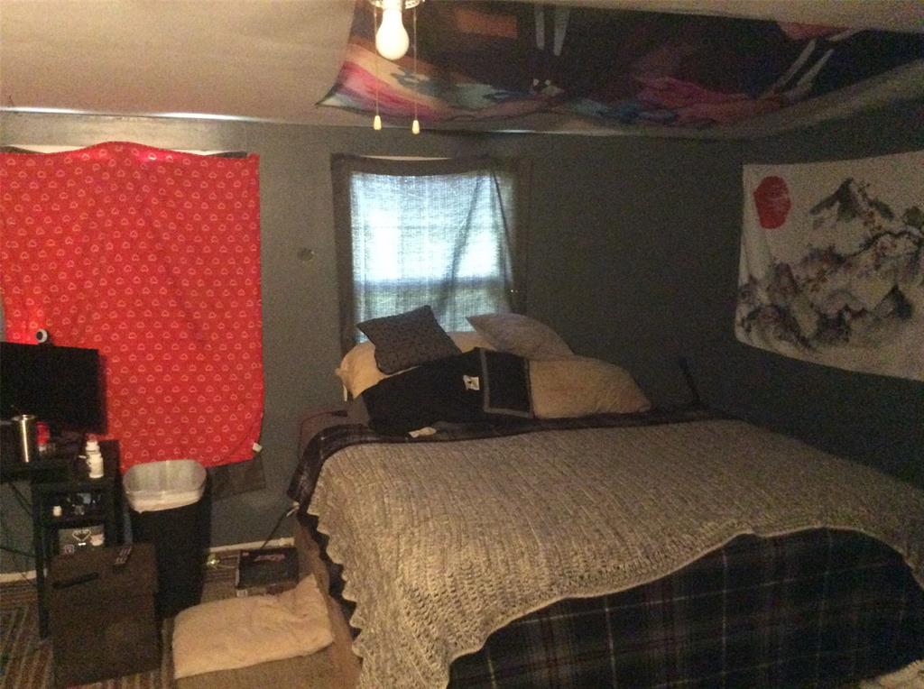 8762 Private Road 4641 Baird, TX 79504 - Photo 13 of 36 a large bed sitting in a bedroom next to a window